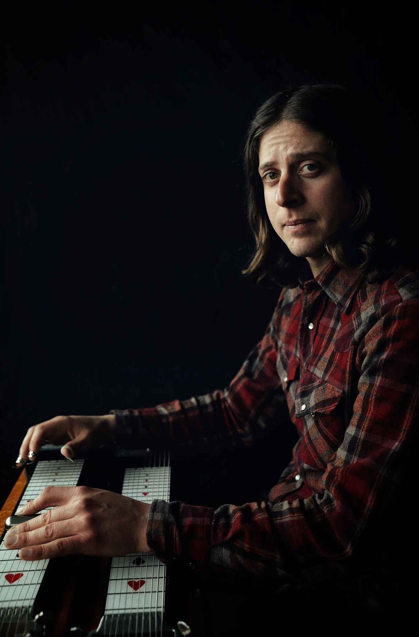 Tebbs Karney seated at his pedal steel guitar